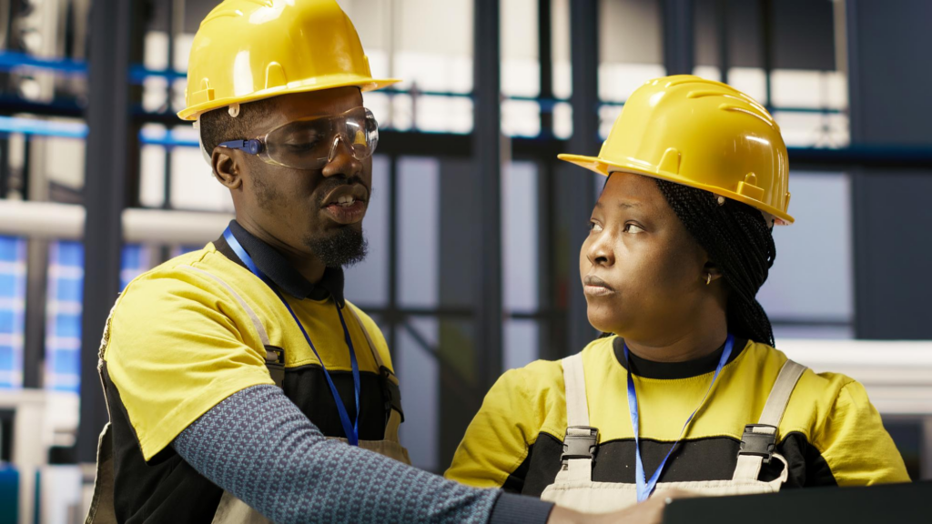 Two construction workers discussing safety.
