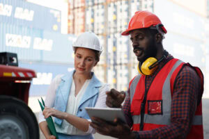 A workplace health and safety officer inspecting a machine